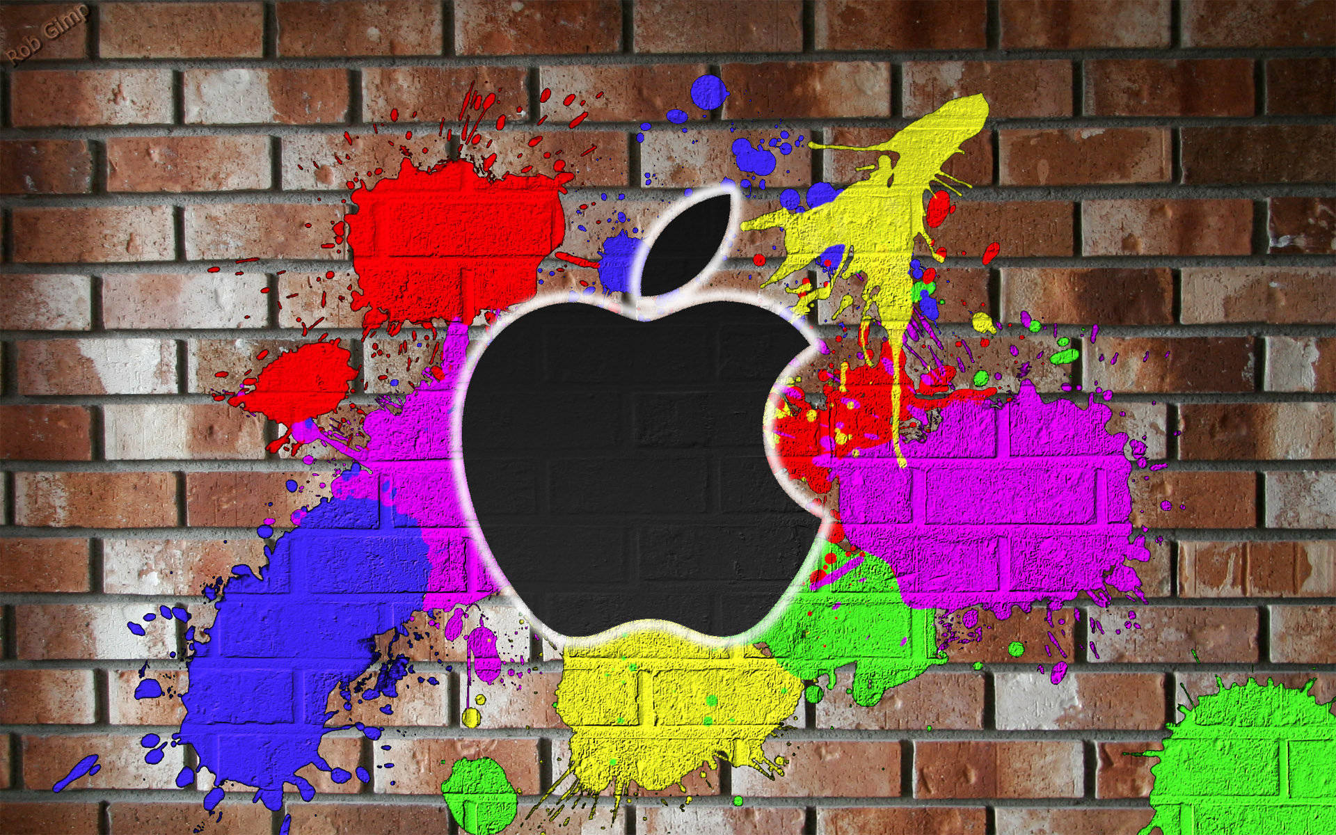 潑彩蘋果 macOS 壁紙 — 一個黑色Apple標誌，在風化的磚牆上濺滿鮮豔的顏料。
