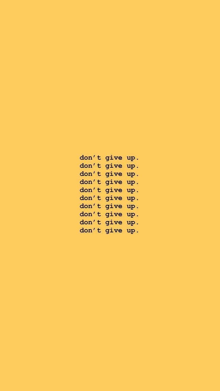 在黃色背景上重複的激勵語 don't give up