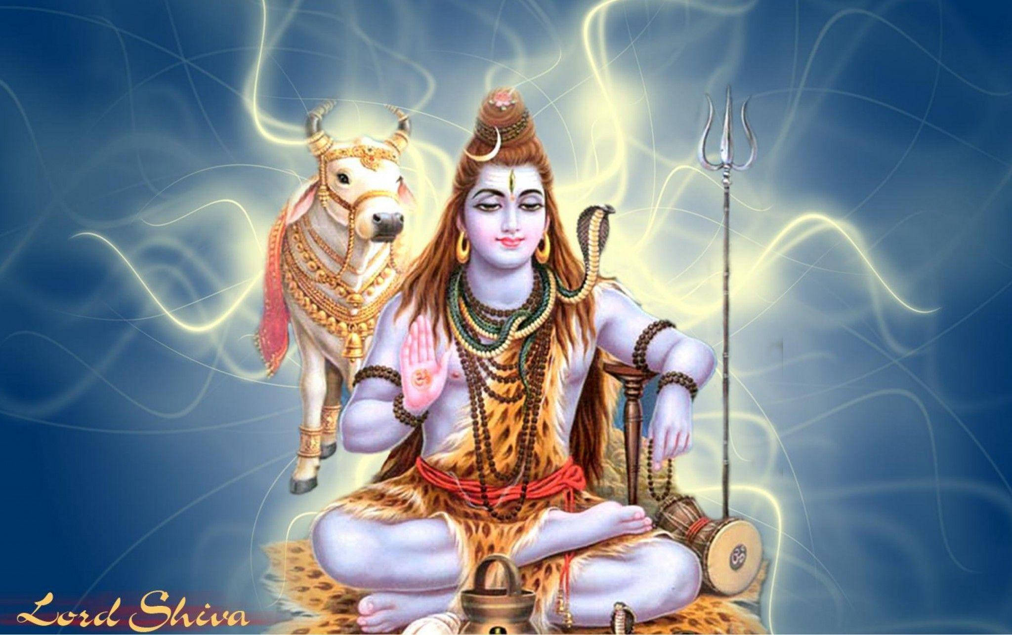 shiv shankar HD 桌布 壁紙 — 濕婆神在蓮花坐姿中寧靜地冥想，旁邊是他的公牛南迪，周圍有發光的能量旋轉。