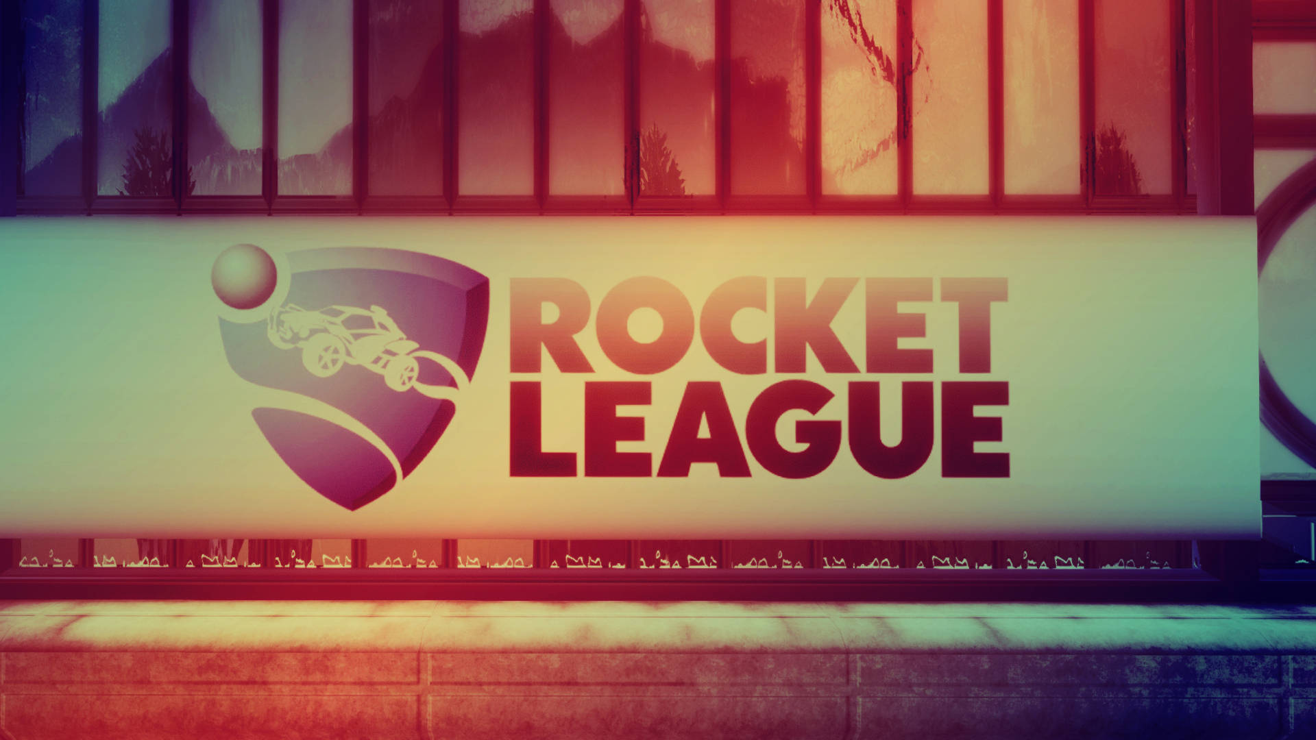 發光廣告牌上的Rocket League遊戲標誌，窗戶中有山脈倒影。