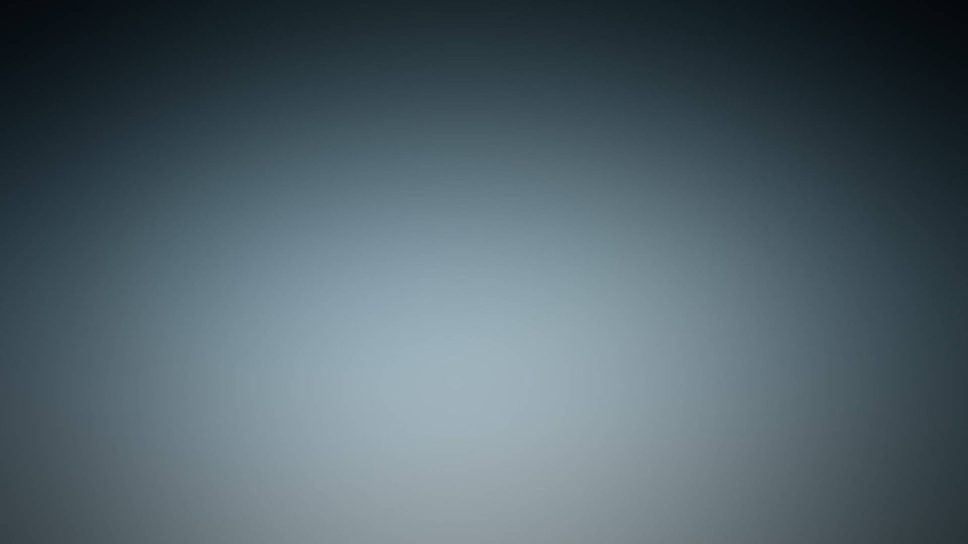 柔和的灰色漸變背景，中心發光。