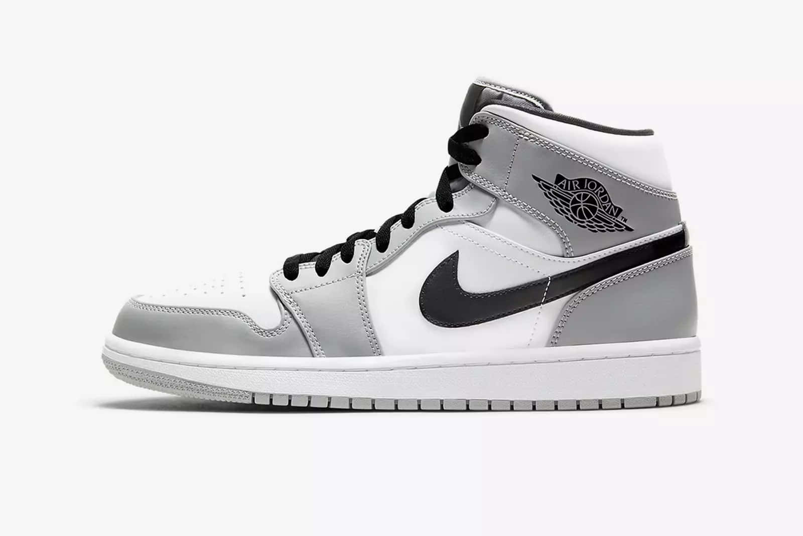 灰黑色高筒運動鞋，帶有Nike勾勾和Air Jordan標誌。
