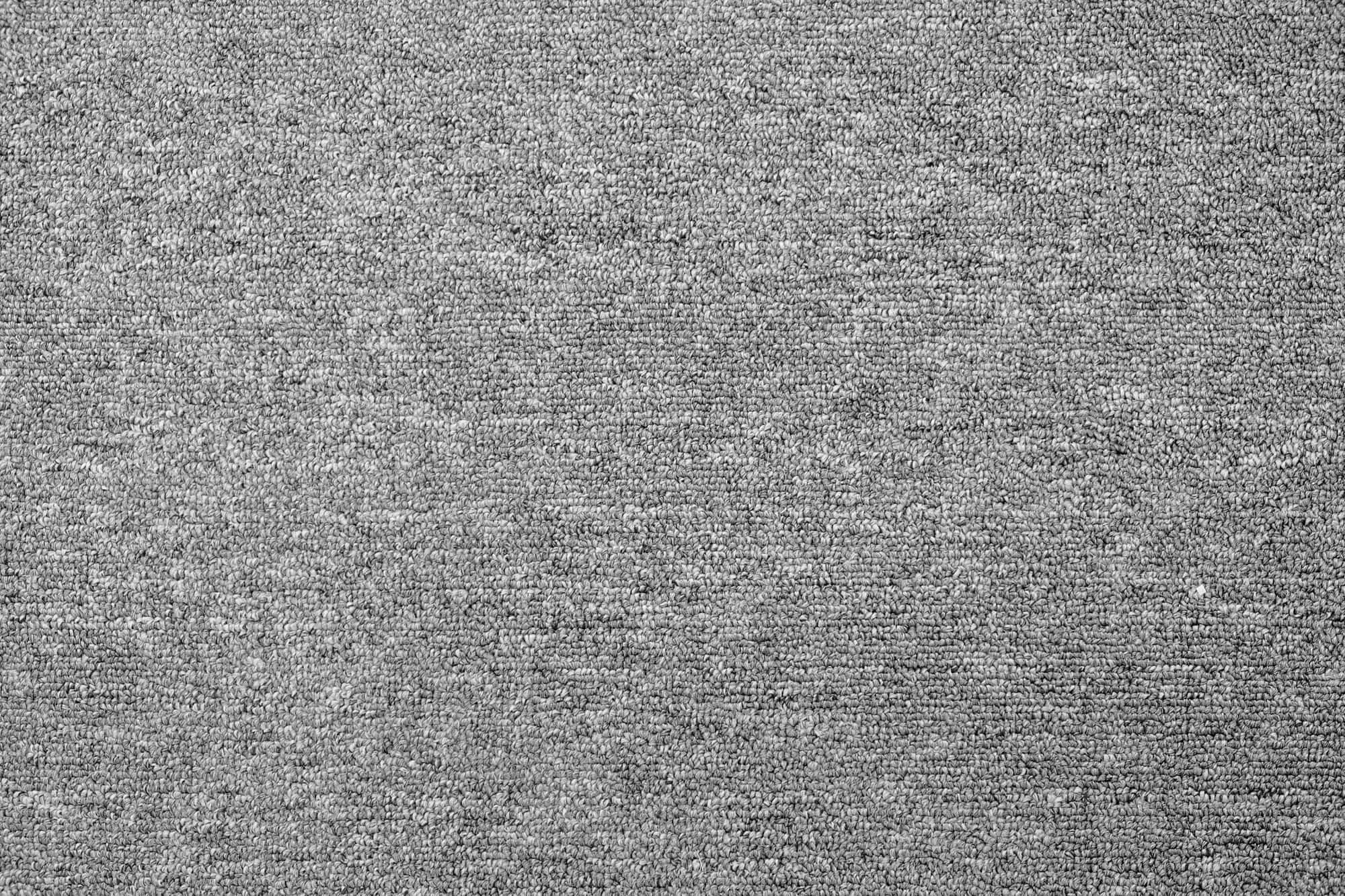 Carpet Texture 桌布 壁紙 — 灰色紋理布料的特寫，帶有微妙的色調變化和柔軟的編織圖案。