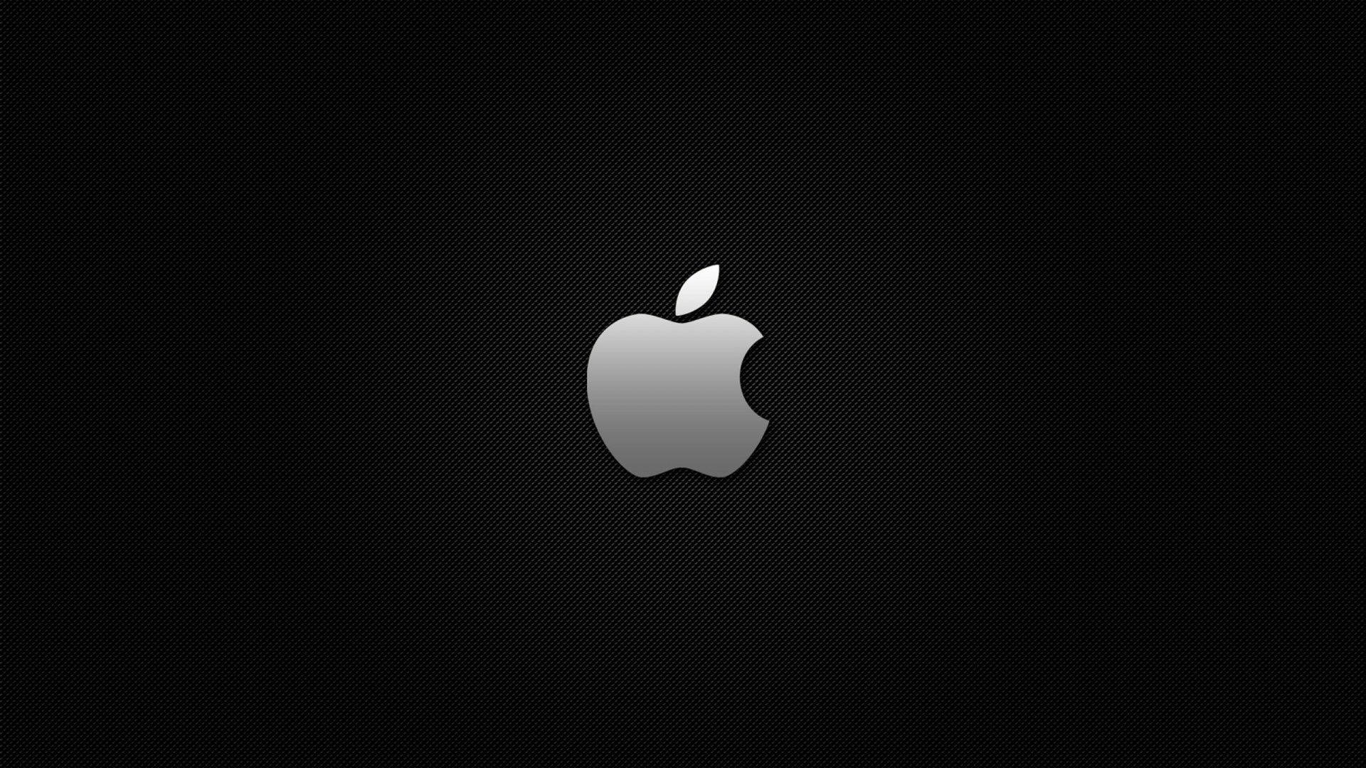 黑色紋理背景上帶有銀色漸變的Apple標誌