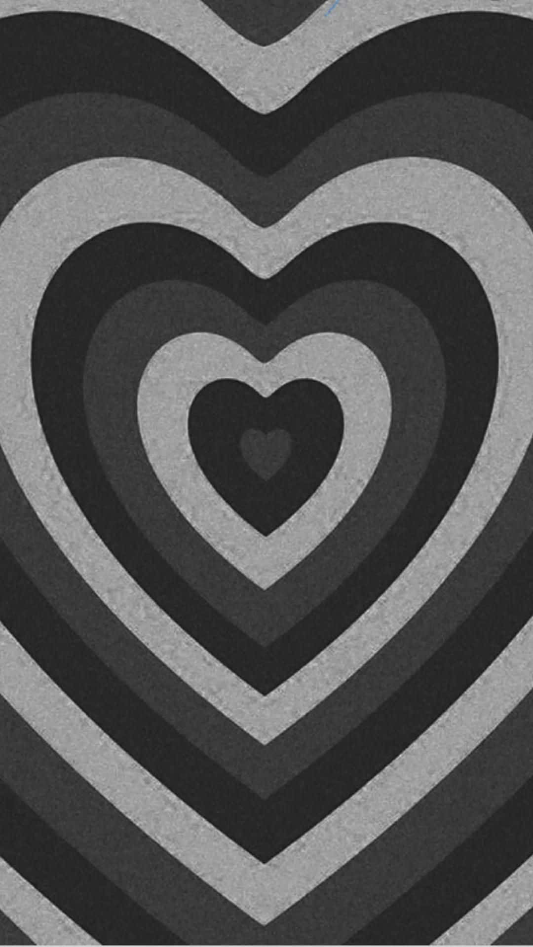 Aesthetic Black Heart 桌布 壁紙 — 灰階色調的同心心形圖案營造出迷人的視覺效果。