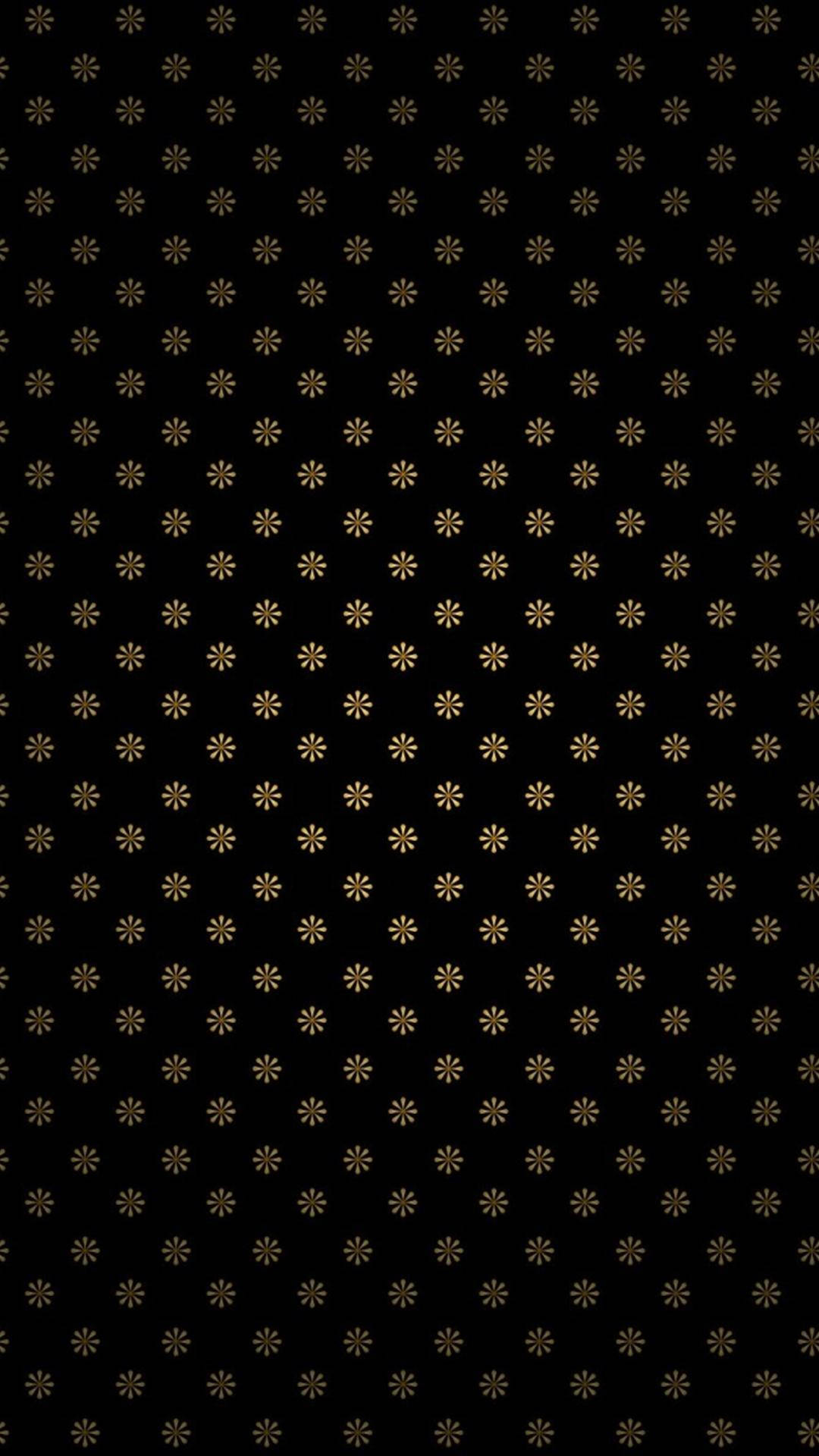 為你的iPhone升級，體驗全新有趣功能 壁紙 — 黑色牆紙，表面均勻分佈重複的小金色星爆圖案。