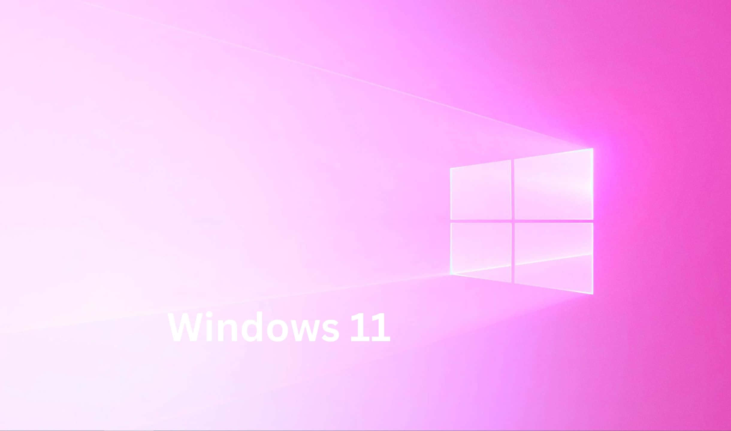 Windows 11標誌在粉紅色漸變背景中發光。