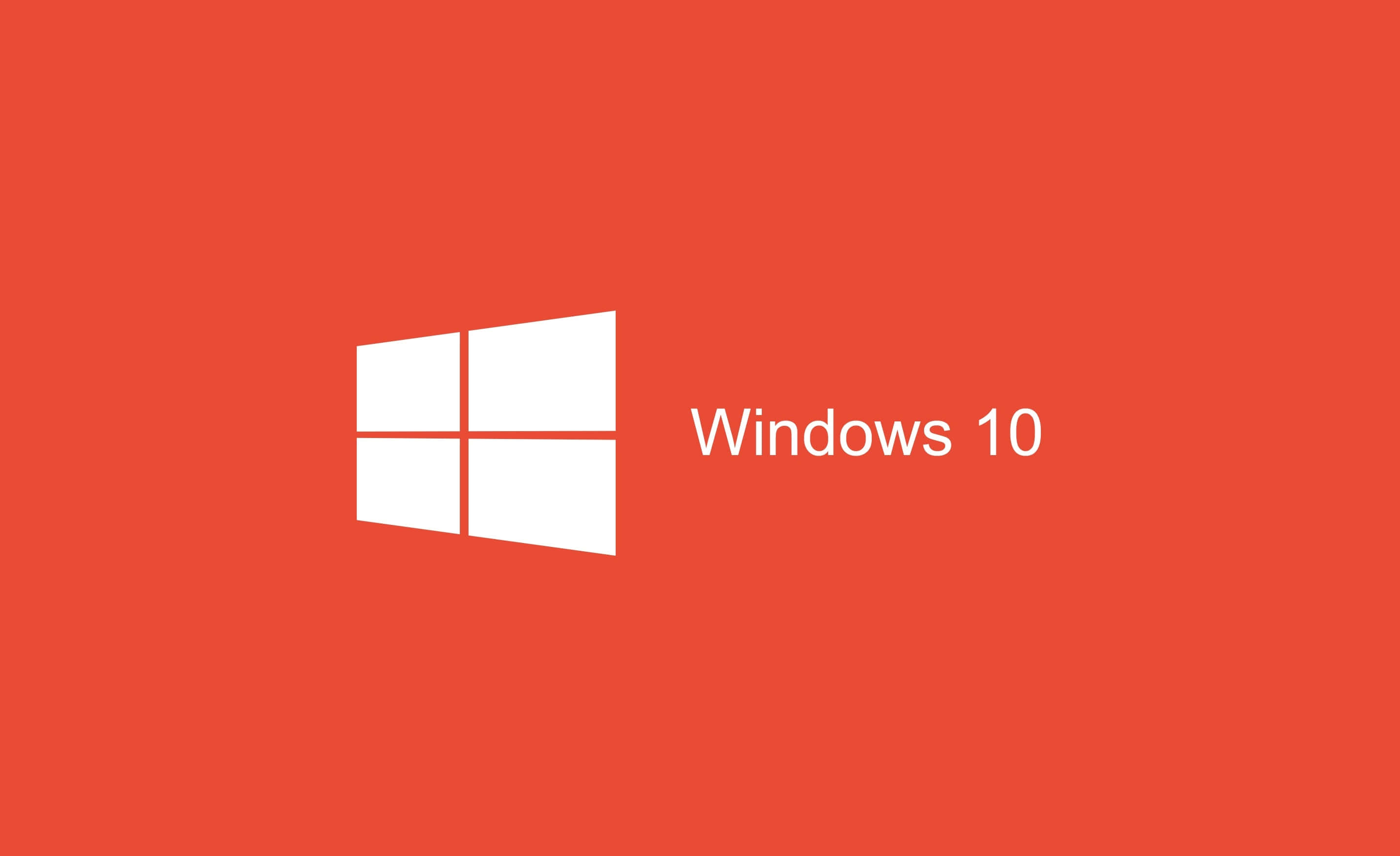 為現代用戶打造的 Windows 10 桌面 壁紙 — 一個極簡的紅色背景，白色Windows 10標誌和文字顯眼地居中顯示。
