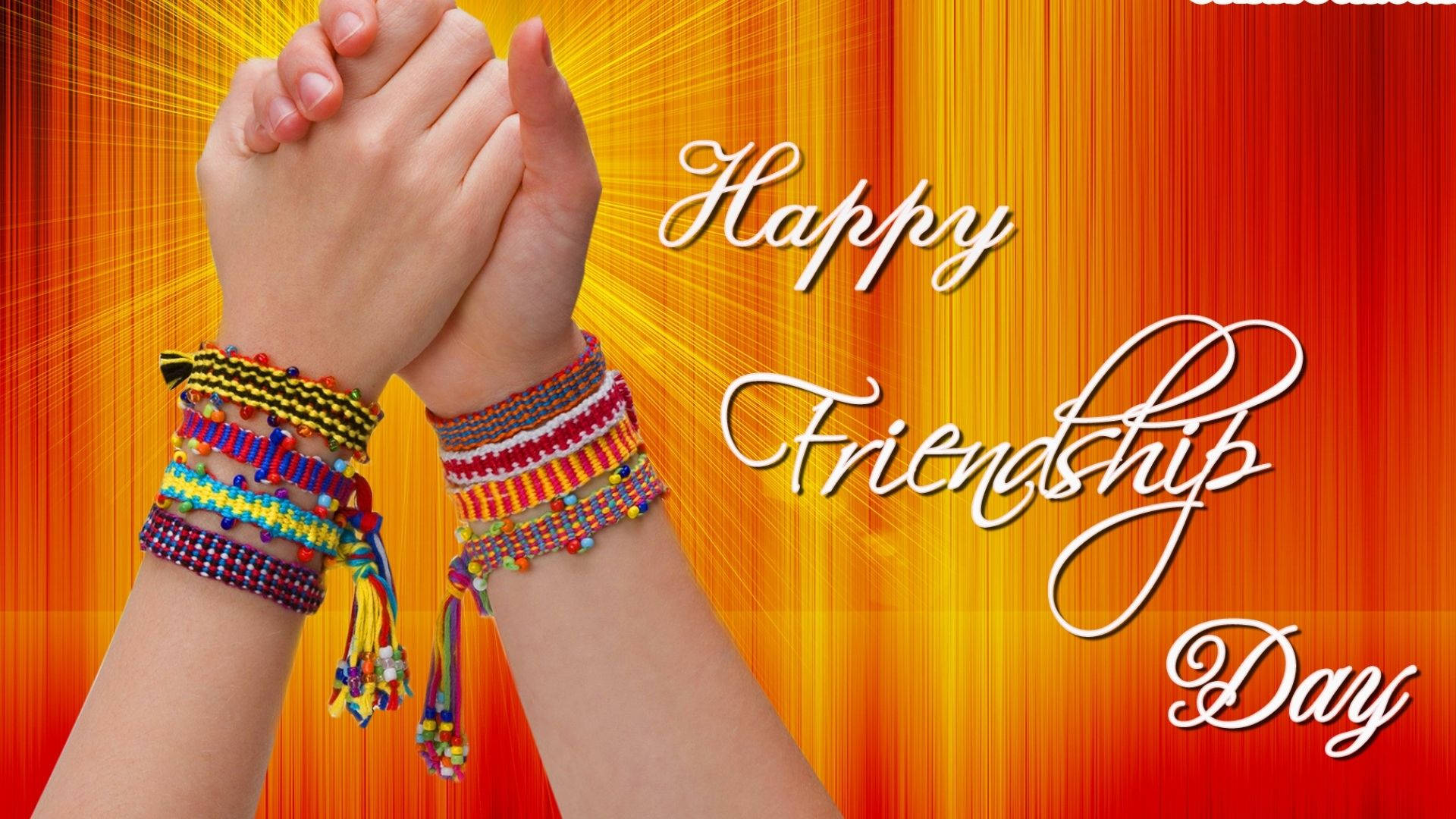 兩隻手緊握在一起，戴著色彩繽紛的友誼手鏈，並帶有 'Happy Friendship Day' 文字。