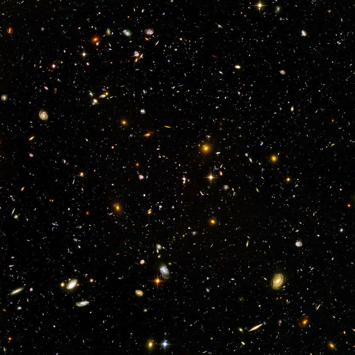 無垠的宇宙領域 壁紙 — 令人嘆為觀止的景色，無數星系和恆星散佈在深邃的黑色太空中。