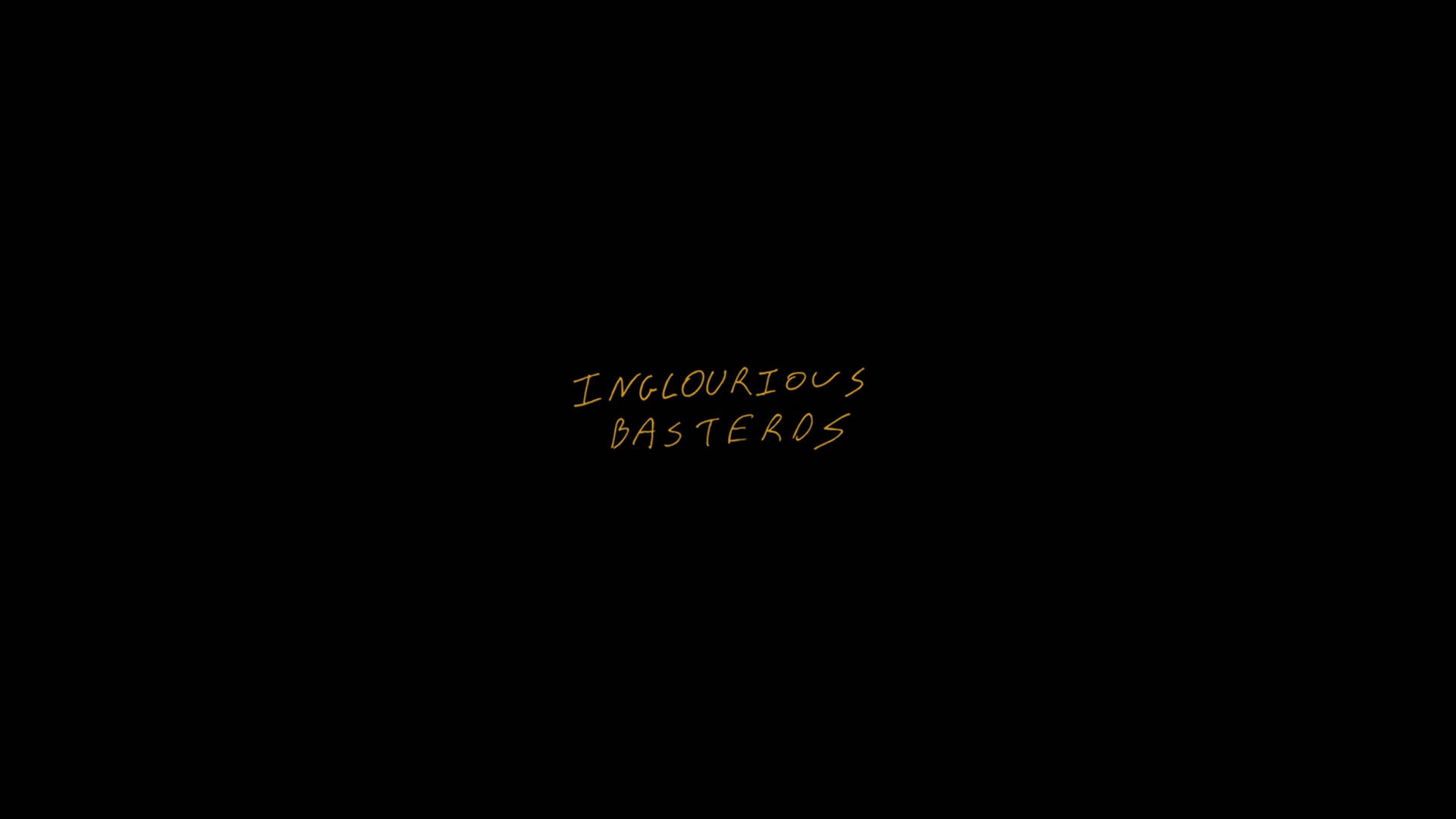 《無恥混蛋》黑屏 壁紙 — 金色手寫文字在純黑色背景中央顯示「INGLOURIOUS BASTEROS」。
