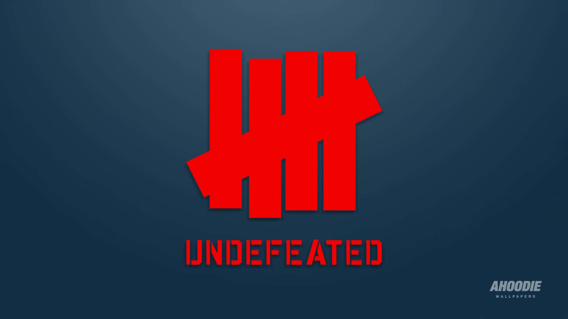 紅色 Undefeated 標誌在深藍色漸變背景上