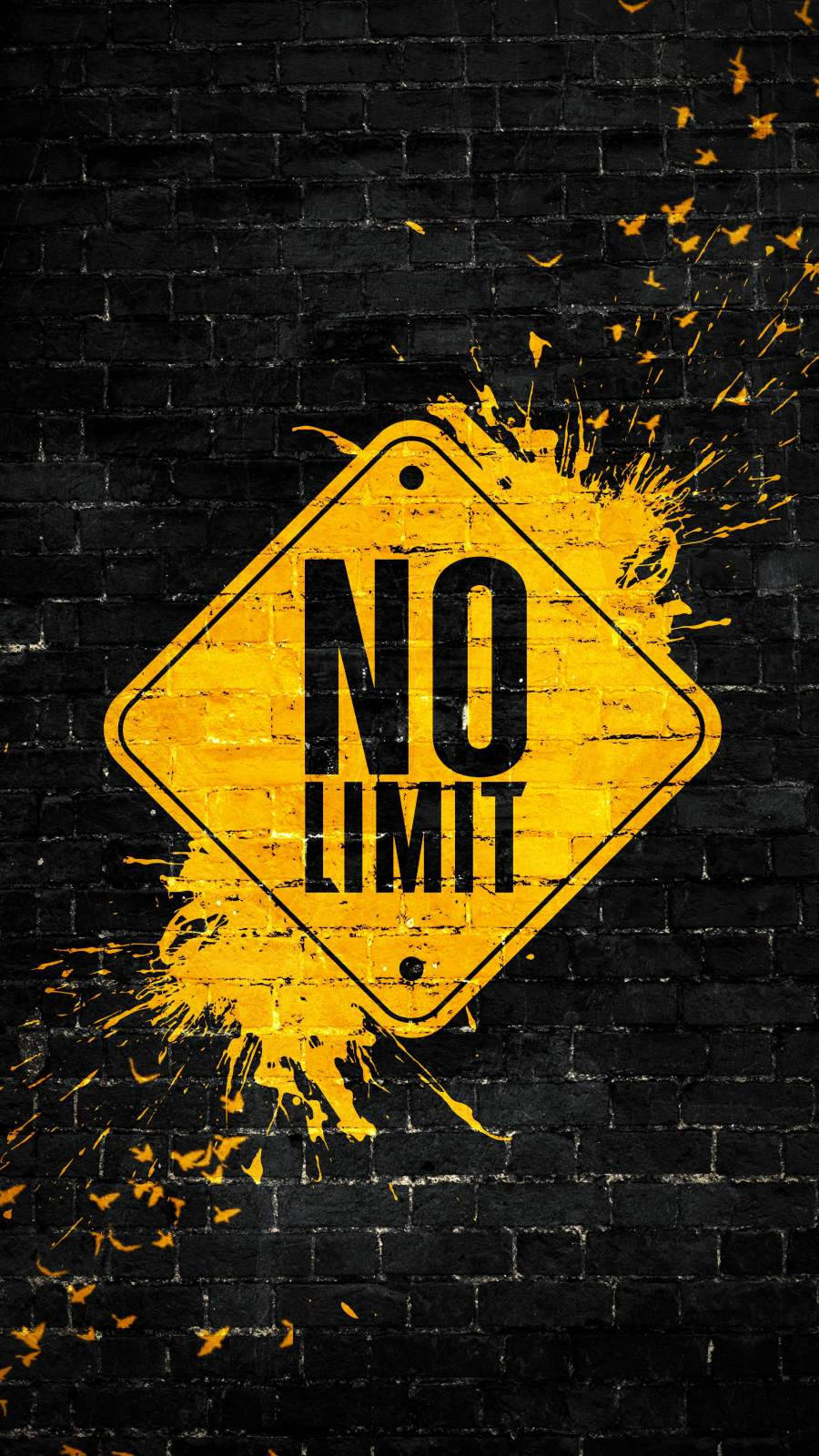 黑色磚牆上帶有油漆飛濺的黃色「NO LIMIT」標誌。