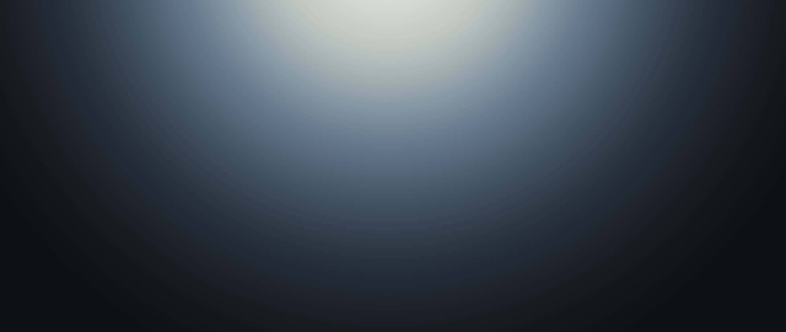 無縫灰階漸層背景 壁紙 — 從亮白中心到深黑邊緣的平滑漸變，營造出極簡抽象的光芒。
