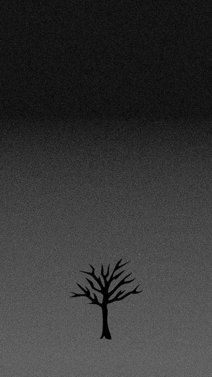 無葉樹 XXXTentacion 美學 壁紙 — 一棵光禿禿的樹木的鮮明黑色剪影，獨自矗立在帶有細微顆粒紋理的漸變灰色天空前。