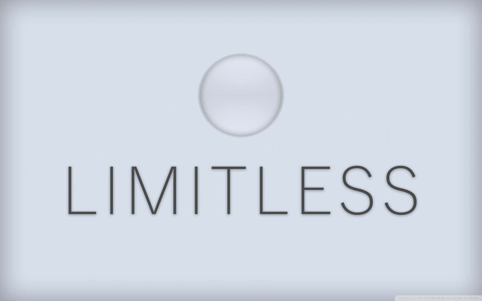 一個時尚的灰色牆板，上面有「limitless」字樣和一個圓形按鈕。