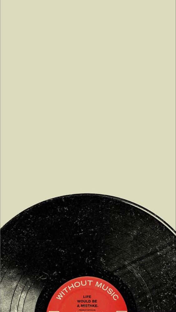 黑膠唱片，帶有紅色標籤，上面寫著「Without Music Life Would Be A Mistake」，背景為米色。