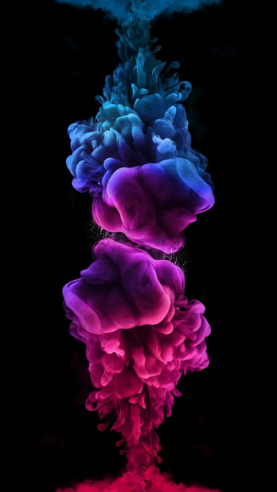 動態的藍色和洋紅色墨水漩渦在黑色背景上向下流動。