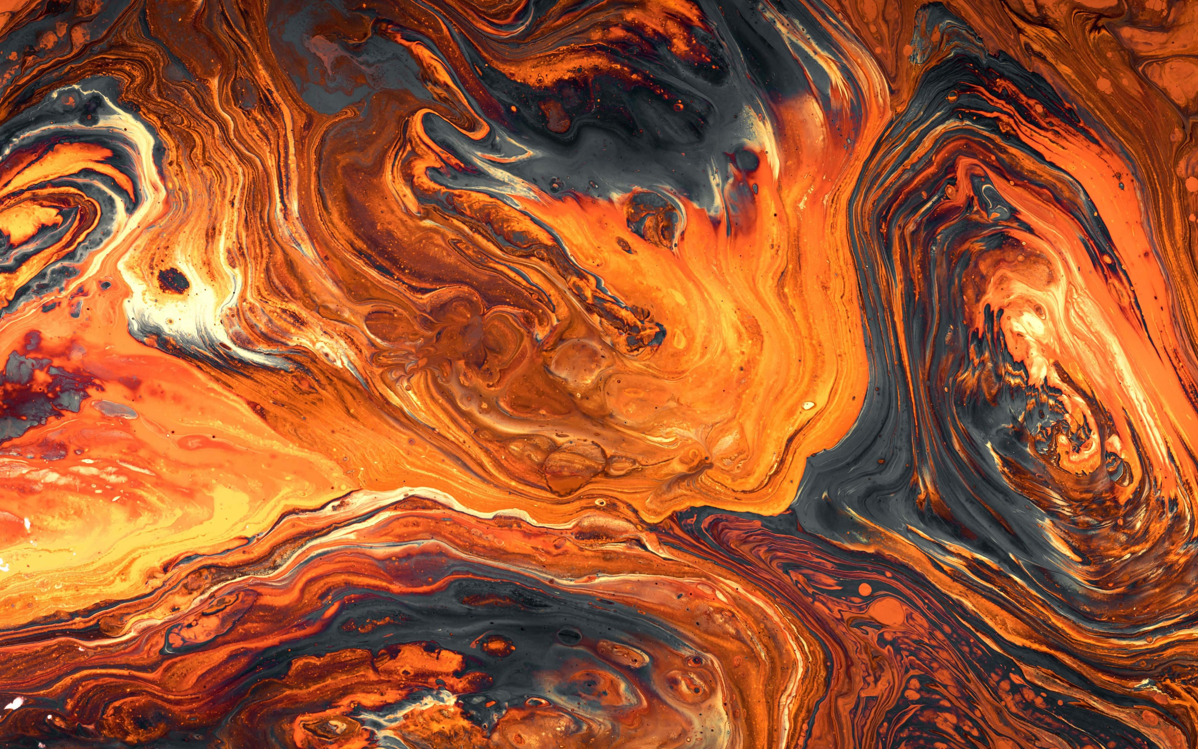 texture 桌布 壁紙 — 熔融橙紅色和深藍黑色液體顏料形成的充滿活力的漩渦抽象圖案。