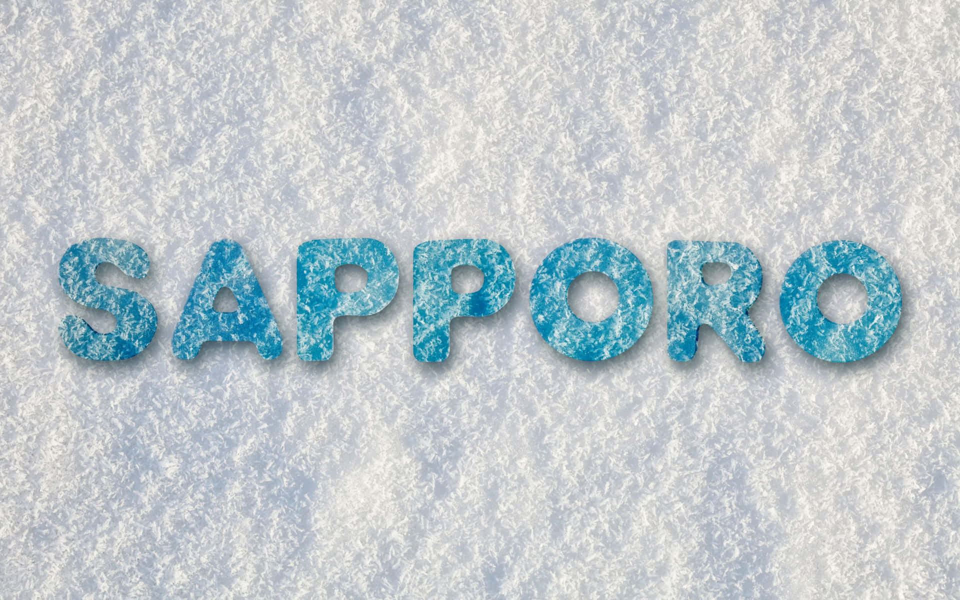 藍色冰塊字母在雪地上拼出 sapporo。