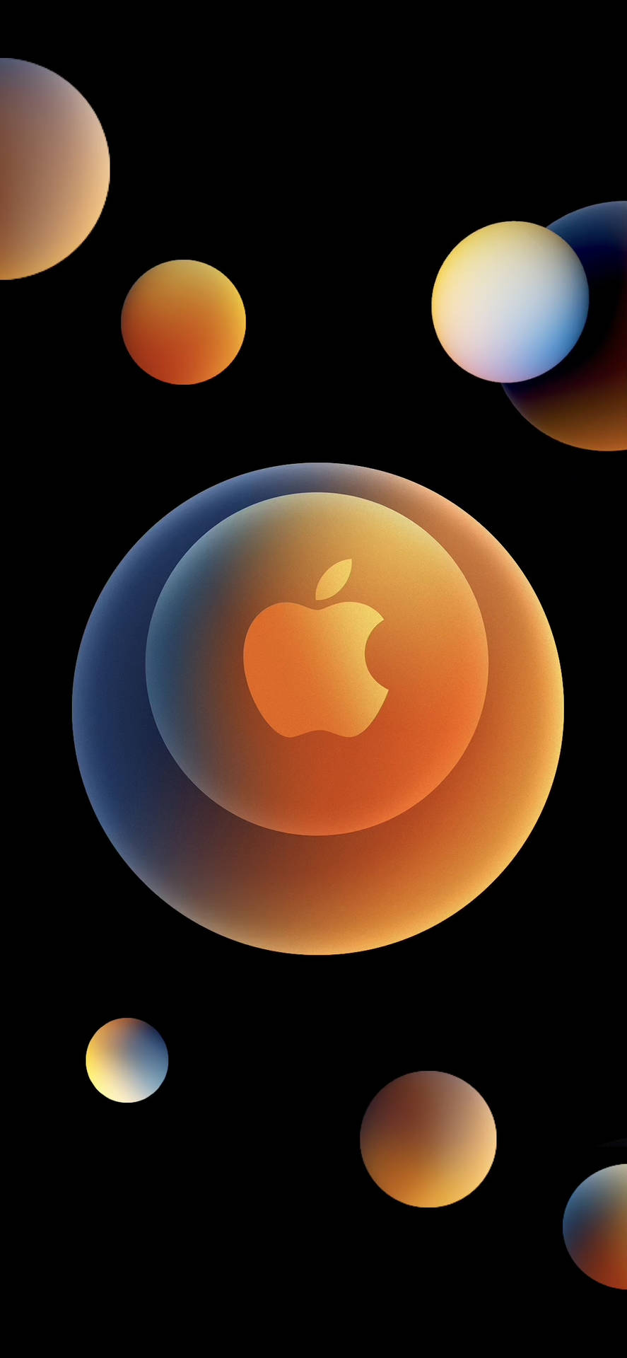 發光的Apple標誌在漸變球體中，周圍漂浮著色彩繽紛的球體，背景為黑色。