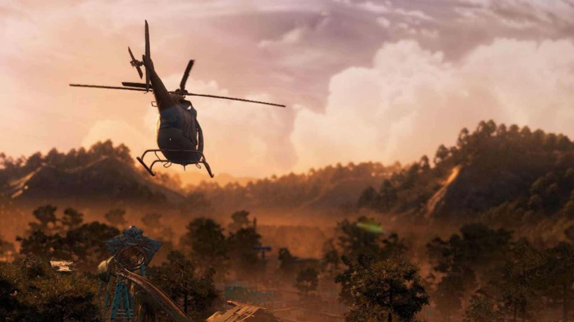 熱門遊戲《孤島驚魂：新曙光》的壯麗風景 壁紙 — 一架直升機在日落時分盤旋於森林覆蓋的山谷上空，在樹木和山丘上投下長長的陰影。