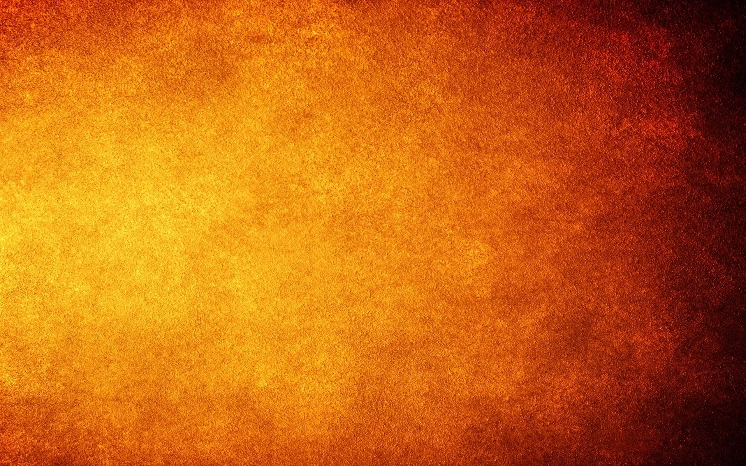 Cool Orange 桌布 壁紙 — 熾熱的紋理漸變，由發光的橙色和深紅色組成，在整個畫面中喚起溫暖和強烈感。