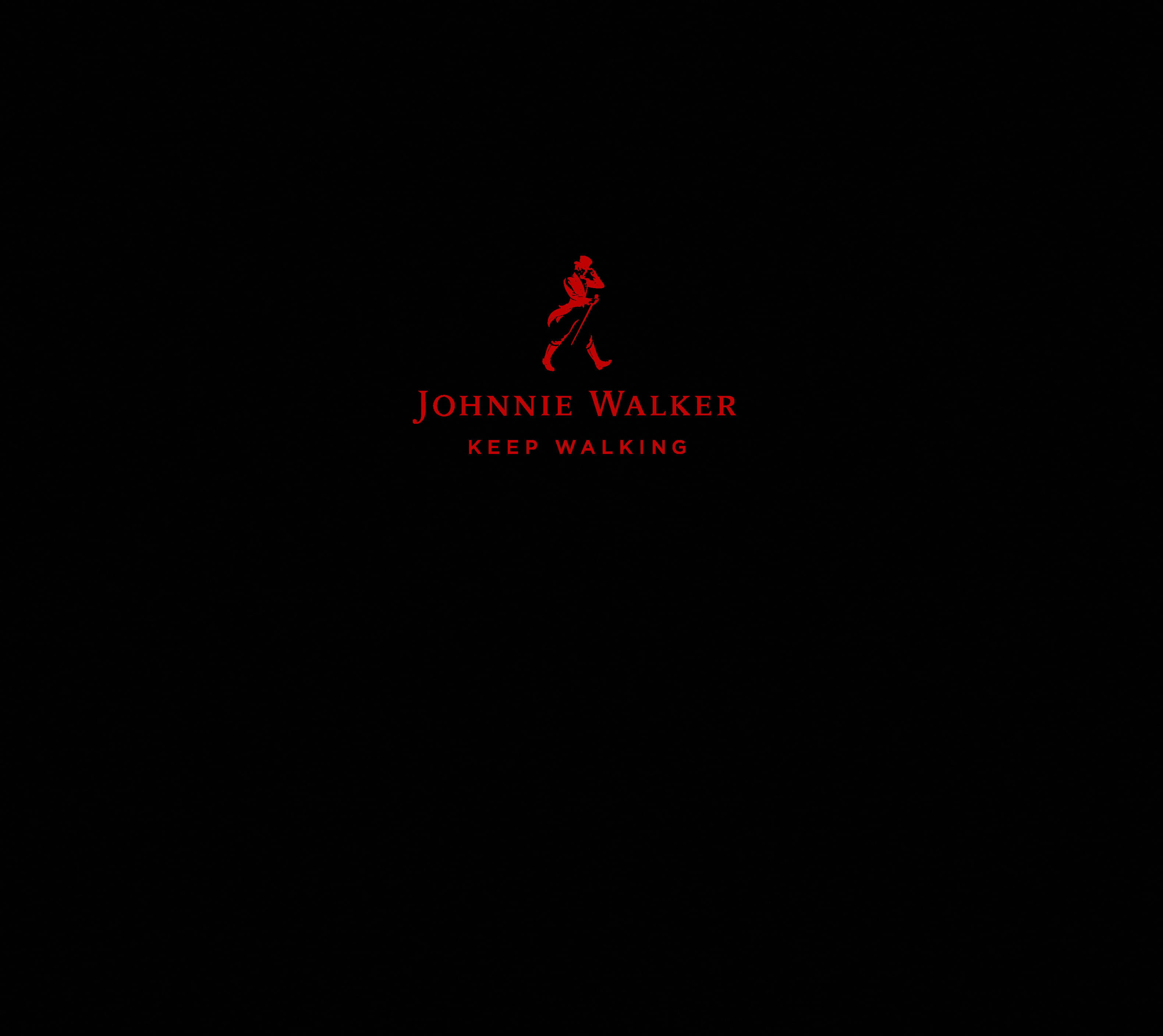 獨特Johnnie Walker紅色標誌與口號 壁紙 — 簡約黑色背景上有一個紅色的男人行走剪影，並配上相應紅色的文字 Johnnie Walker Keep Walking。