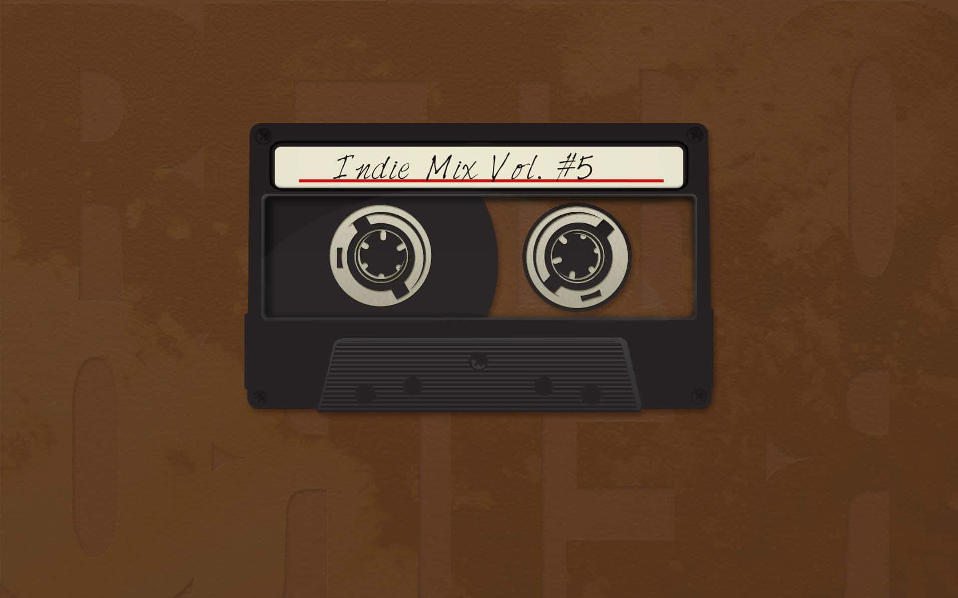 在棕色紋理背景上，一盒標有 Indie Mix Vol 5 的黑色卡式錄音帶。