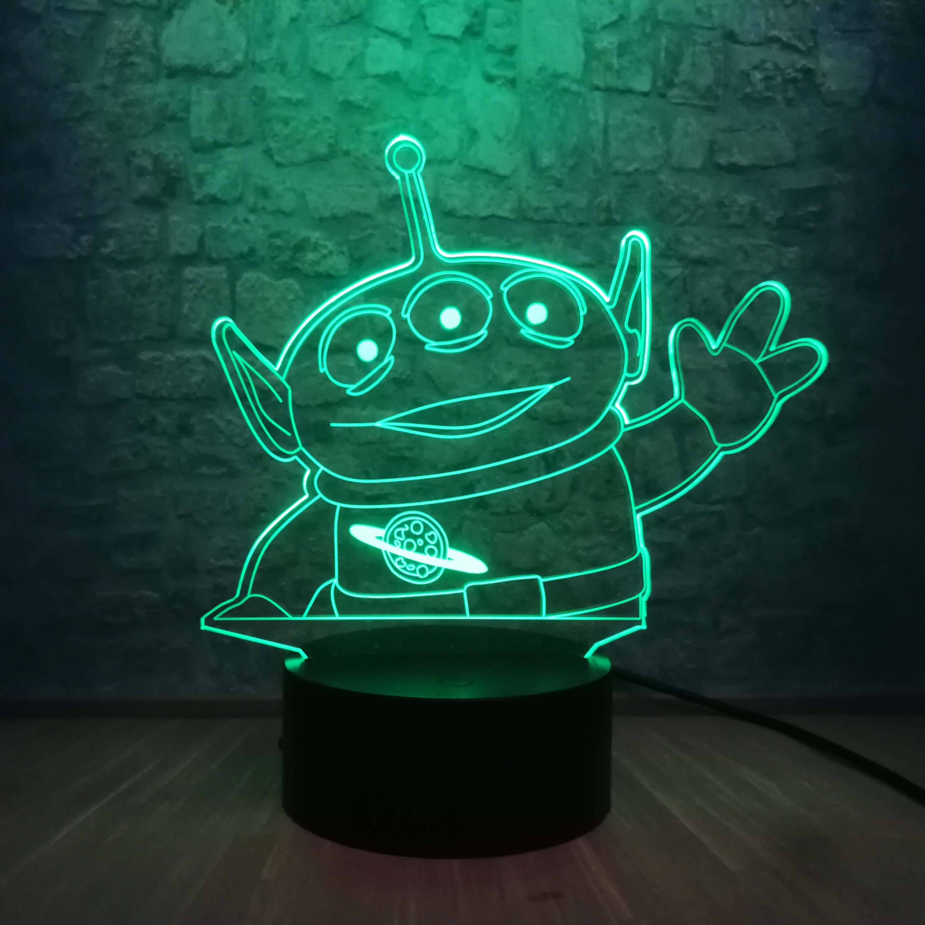 玩具總動員霓虹燈立牌外星人 壁紙 — 一個發光綠色3D幻覺燈，形狀像《反斗奇兵》中的三眼外星人，對著深色磚牆愉快地揮手。