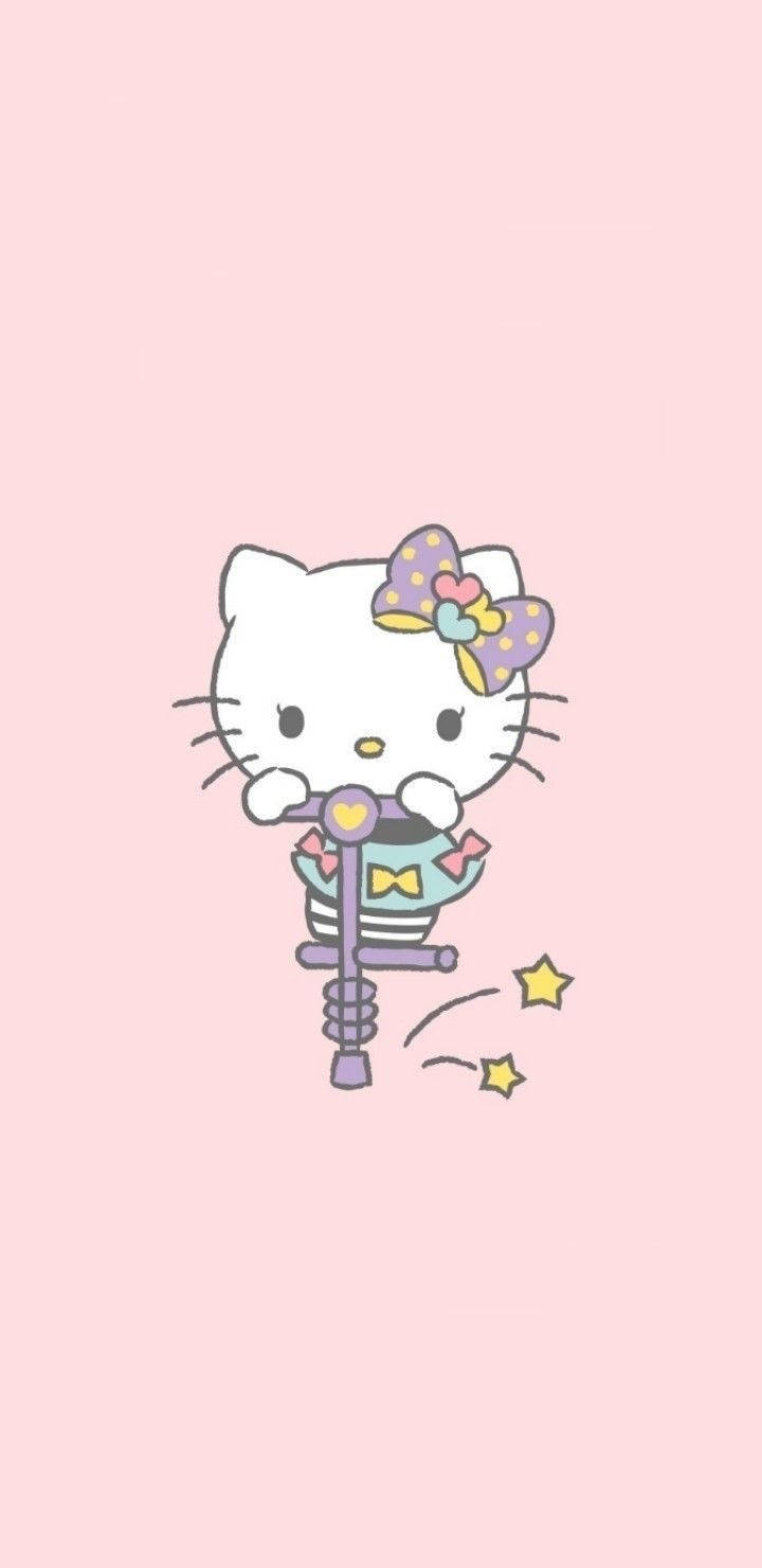 Hello Kitty 喺粉紅色背景上用彈簧棒彈跳，帶有閃光效果 — Hello kitty 美學 GIF 壁紙