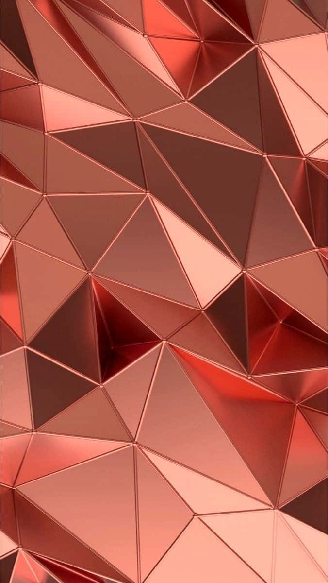 帶有反射表面的玫瑰金三角形的抽象幾何圖案。