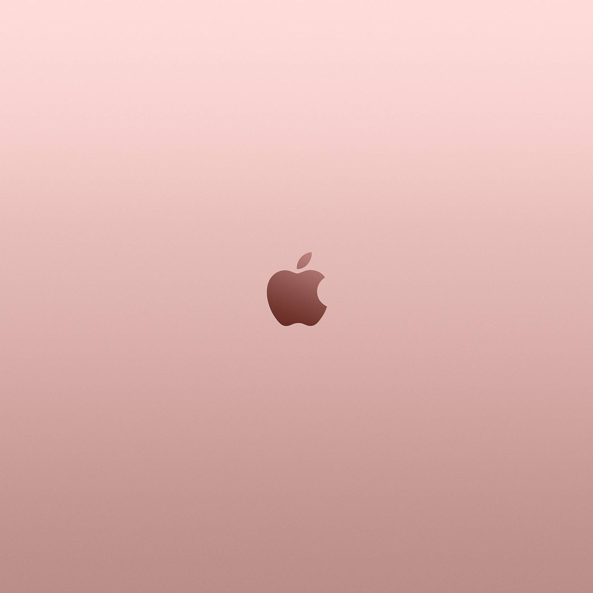 玫瑰金色筆記型電腦，背面中央有Apple標誌