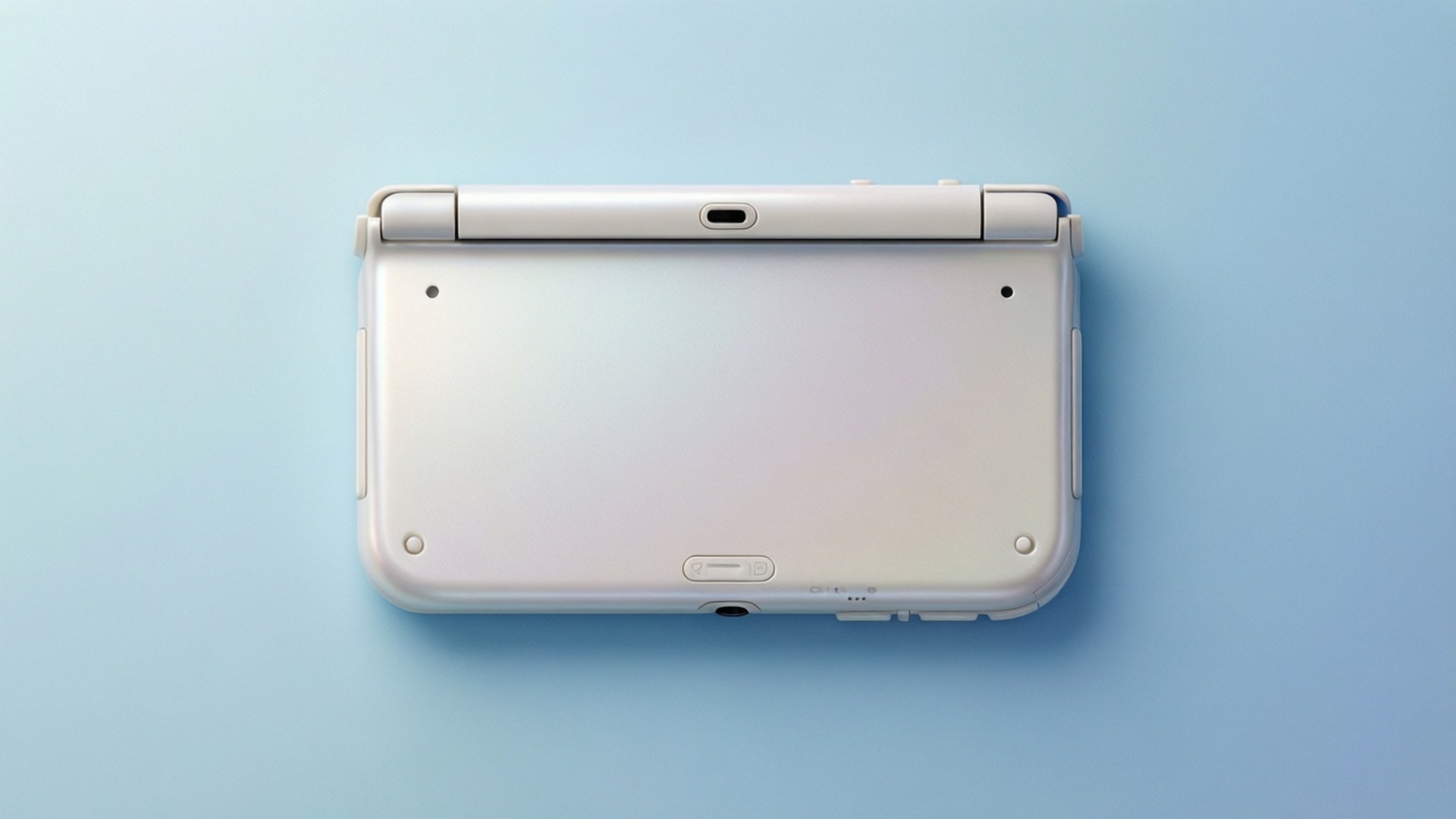 珍珠白極簡風 壁紙 — 白色Nintendo 3DS主機俯視圖，放置在柔軟的藍色背景上。