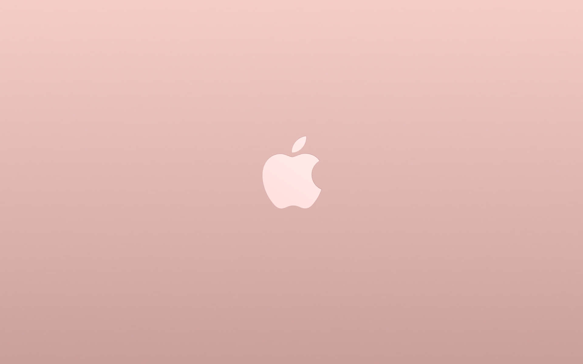 玫瑰金色筆記本電腦蓋，漸變背景上中央白色Apple標誌