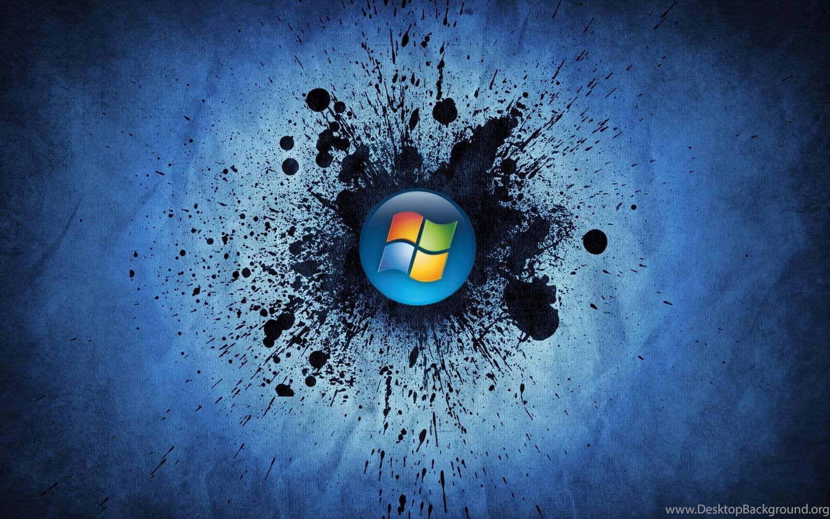 Windows 標誌被帶紋理的藍色背景上的黑色墨水飛濺包圍。