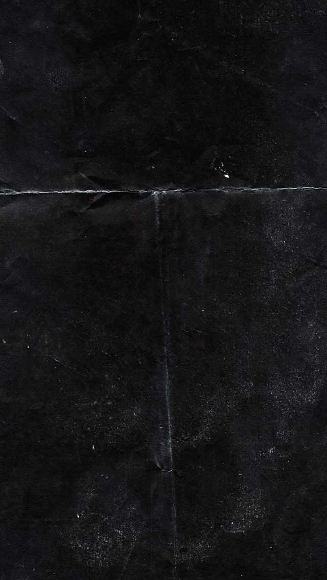 帶有摺痕和表面細節的深色紋理黑紙。
