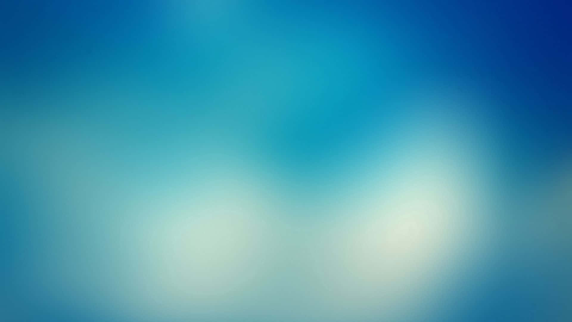 帶有模糊光效的柔和藍白漸變抽象背景。