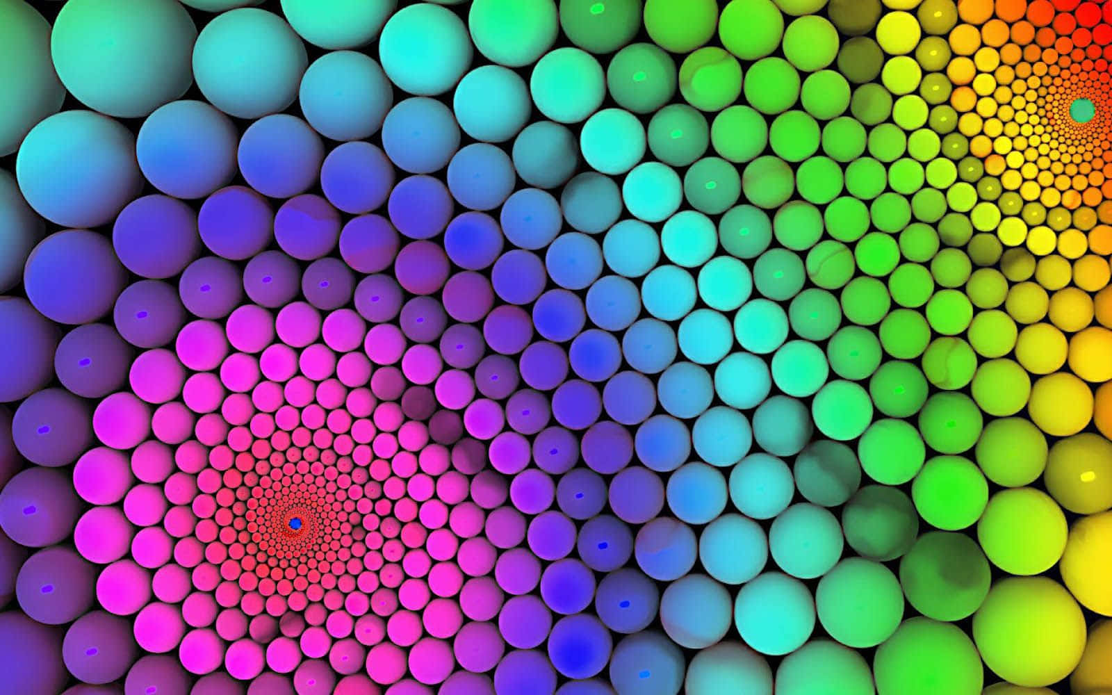 色彩繽紛的球體向內螺旋，形成催眠般的彩虹漩渦圖案。