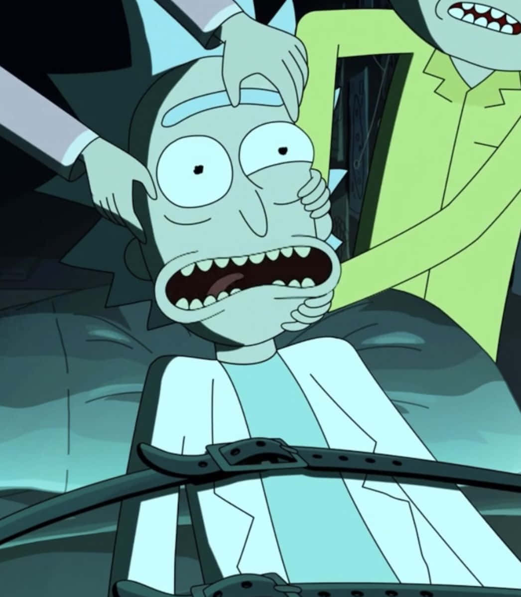 Total Rickall 桌布 壁紙 — 《瑞克和莫蒂》中的瑞克·桑切斯被綁在汽車座椅上，雙手因恐懼而抓著頭。