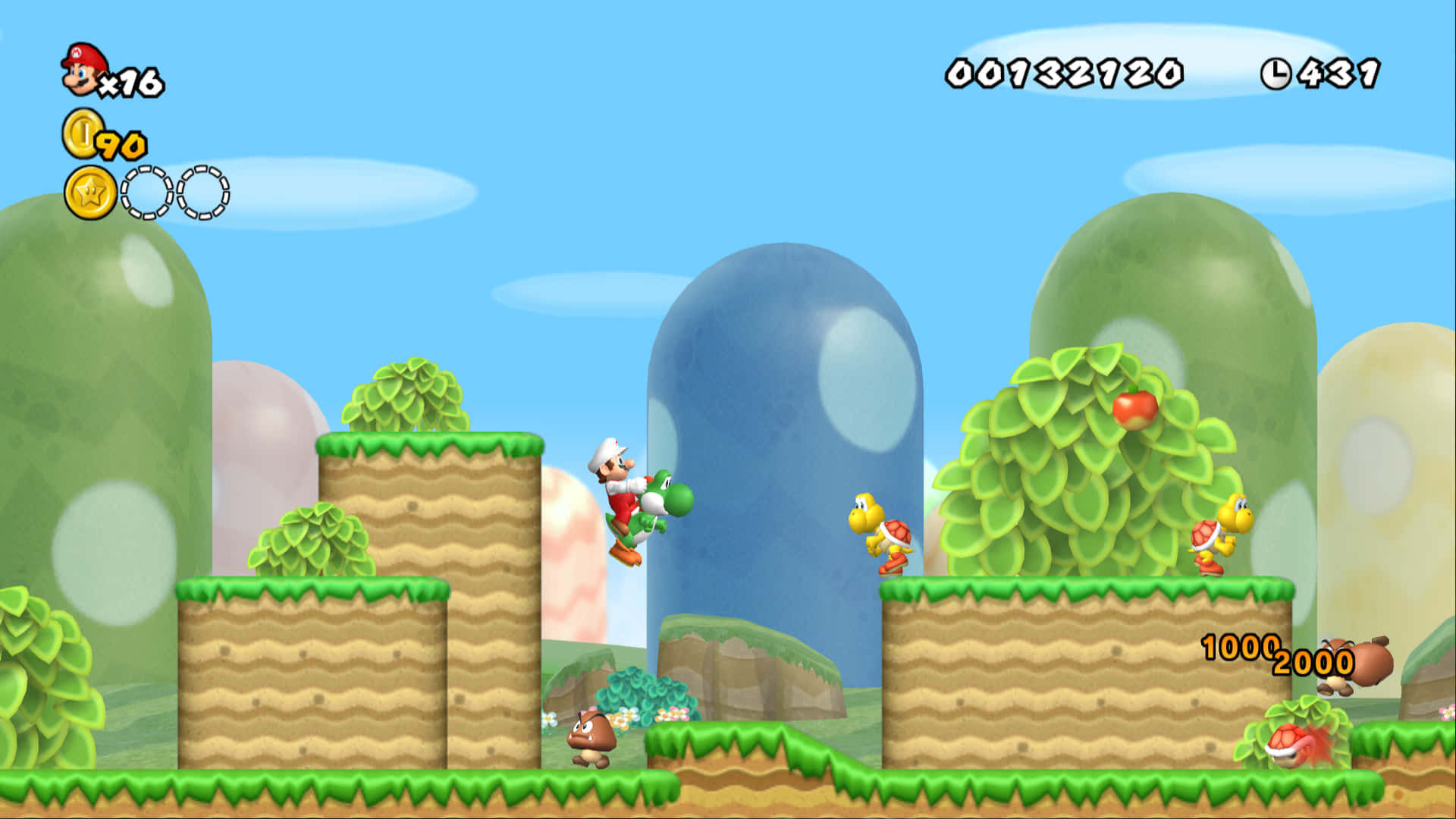 Mushroom Kingdom 桌布 壁紙 — 瑪利歐和耀西在明亮陽光的遊戲關卡中跳過充滿活力的綠色平台，其中有漂浮的金幣和敵人。