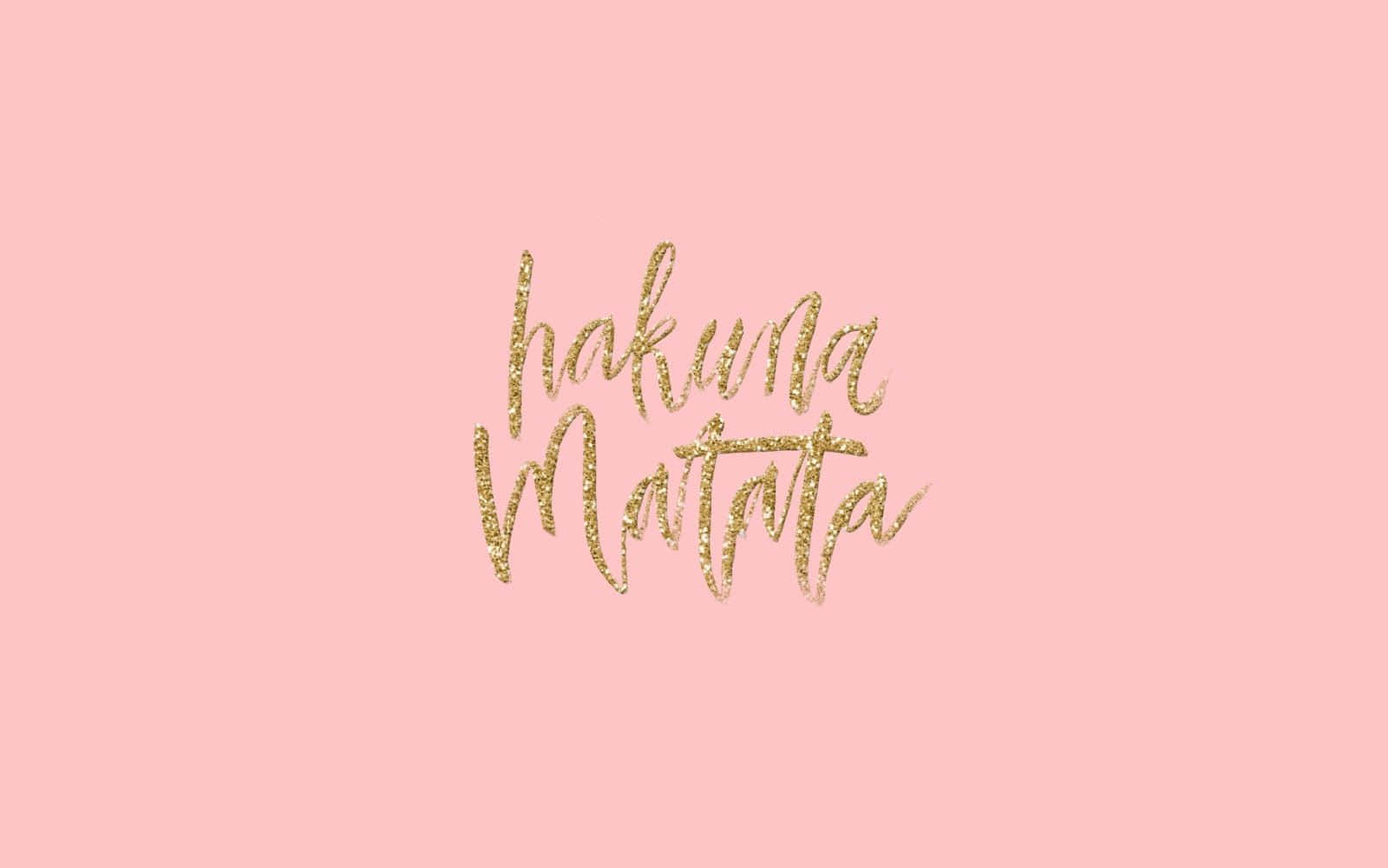 粉紅色背景上的金色閃亮草書文字 hakuna matata。