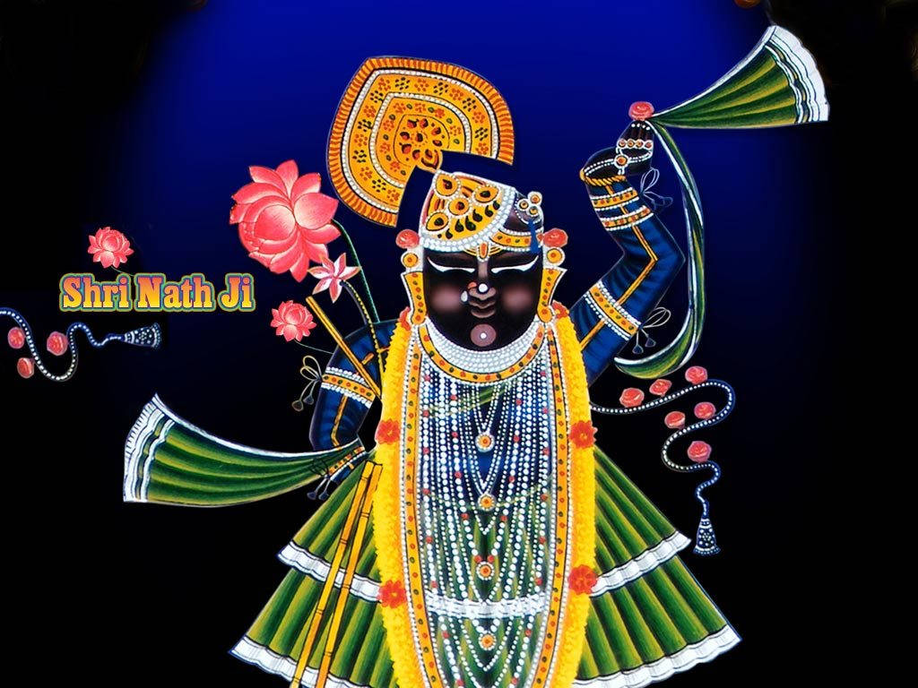 Shrinathji 桌布 壁紙 — 生動描繪的印度教神祇 Shri Nath Ji，身穿華麗的藍綠色服飾，飾有金色點綴和粉紅蓮花，背景為深藍色。
