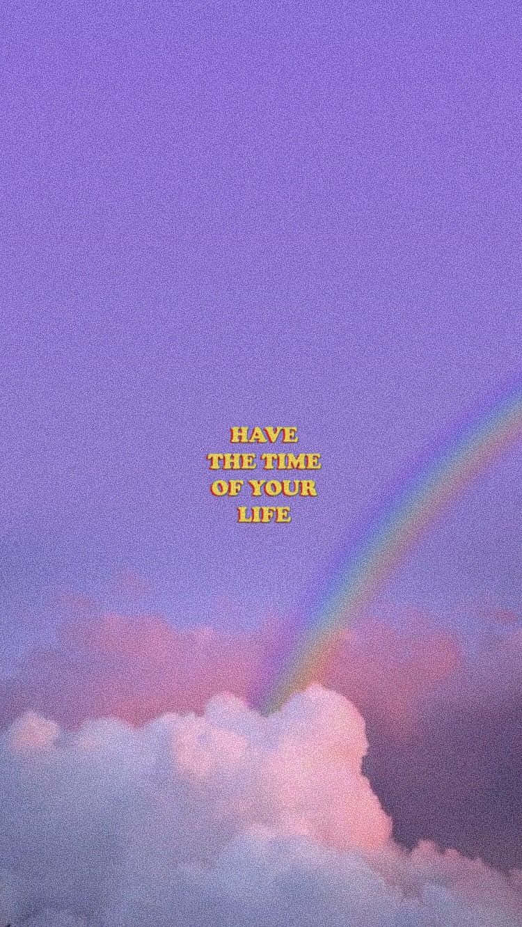 紫色天空，有彩虹和雲朵，文字為 have the time of your life