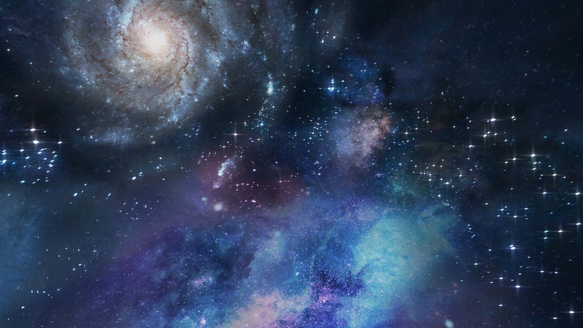 生動色彩深空圖像 壁紙 — 一個令人嘆為觀止的螺旋星系景觀，在深藍色和紫色的星雲背景下，旋轉著宇宙塵埃和發光的恆星。