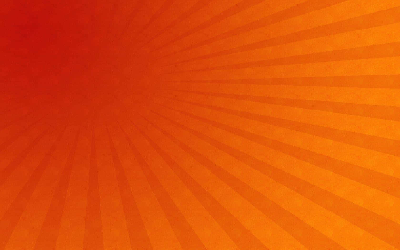 用 Radial 燦爛發光 壁紙 — 充滿活力的橙色放射狀條紋從帶有紋理的中心散發出來，形成動態的太陽爆發圖案。
