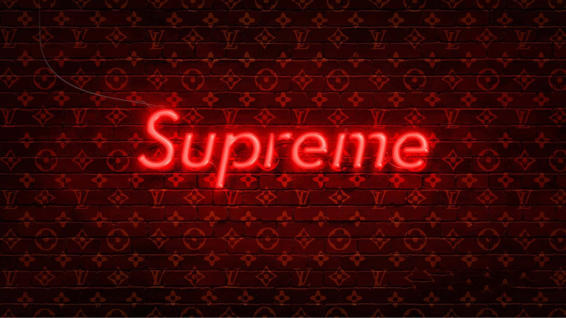 紅色霓虹Supreme招牌在字母圖案磚牆上。