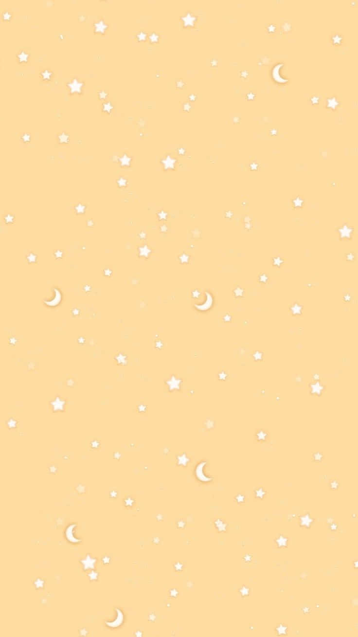柔和黃色背景上的星星和月亮天體圖案。