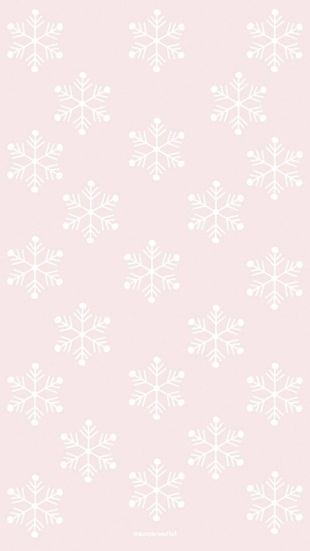 粉紅色背景上的雪花圖案，適合冬季裝飾。
