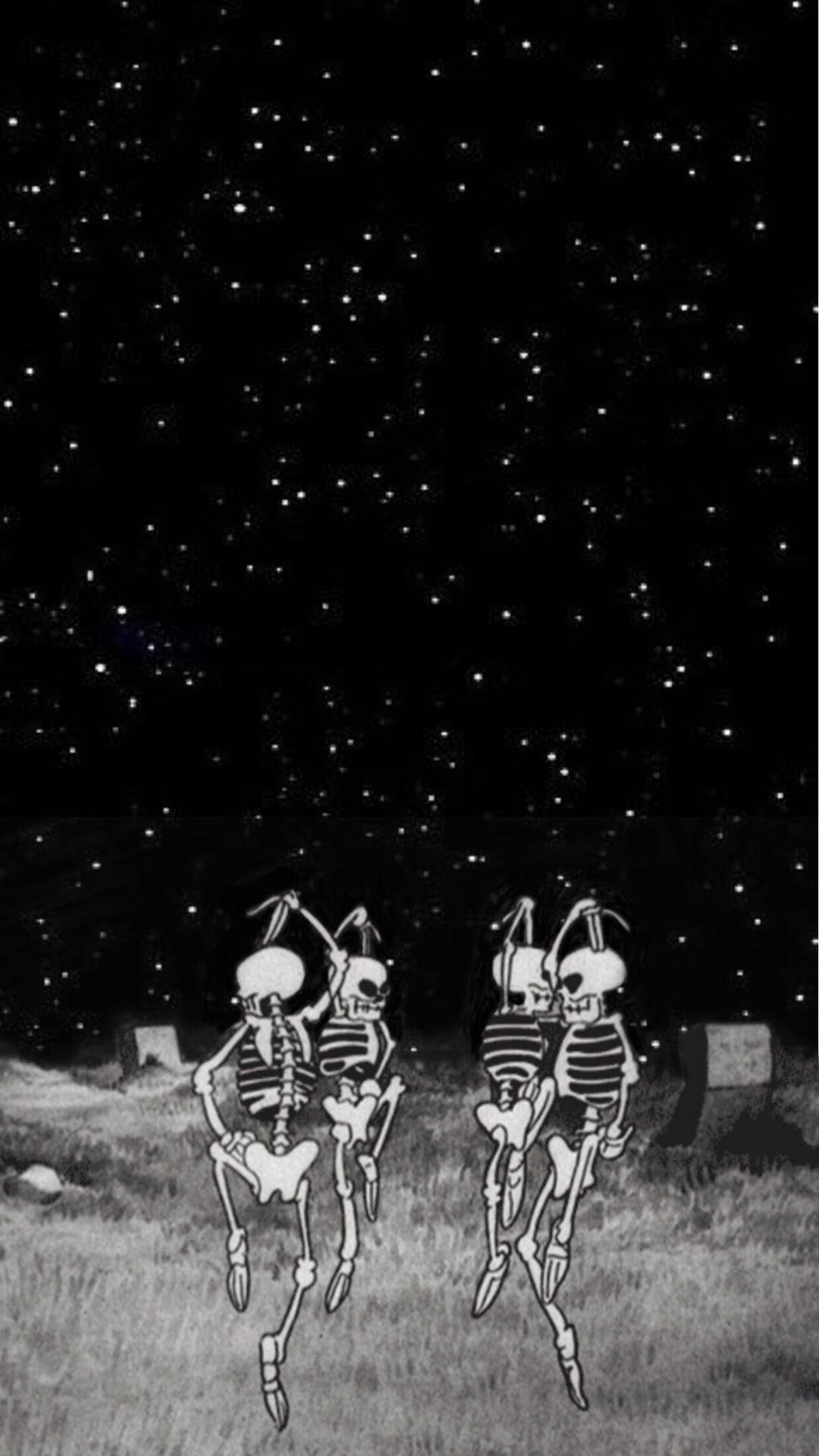 兩個骷髏在星空下的墓園裡跳舞。